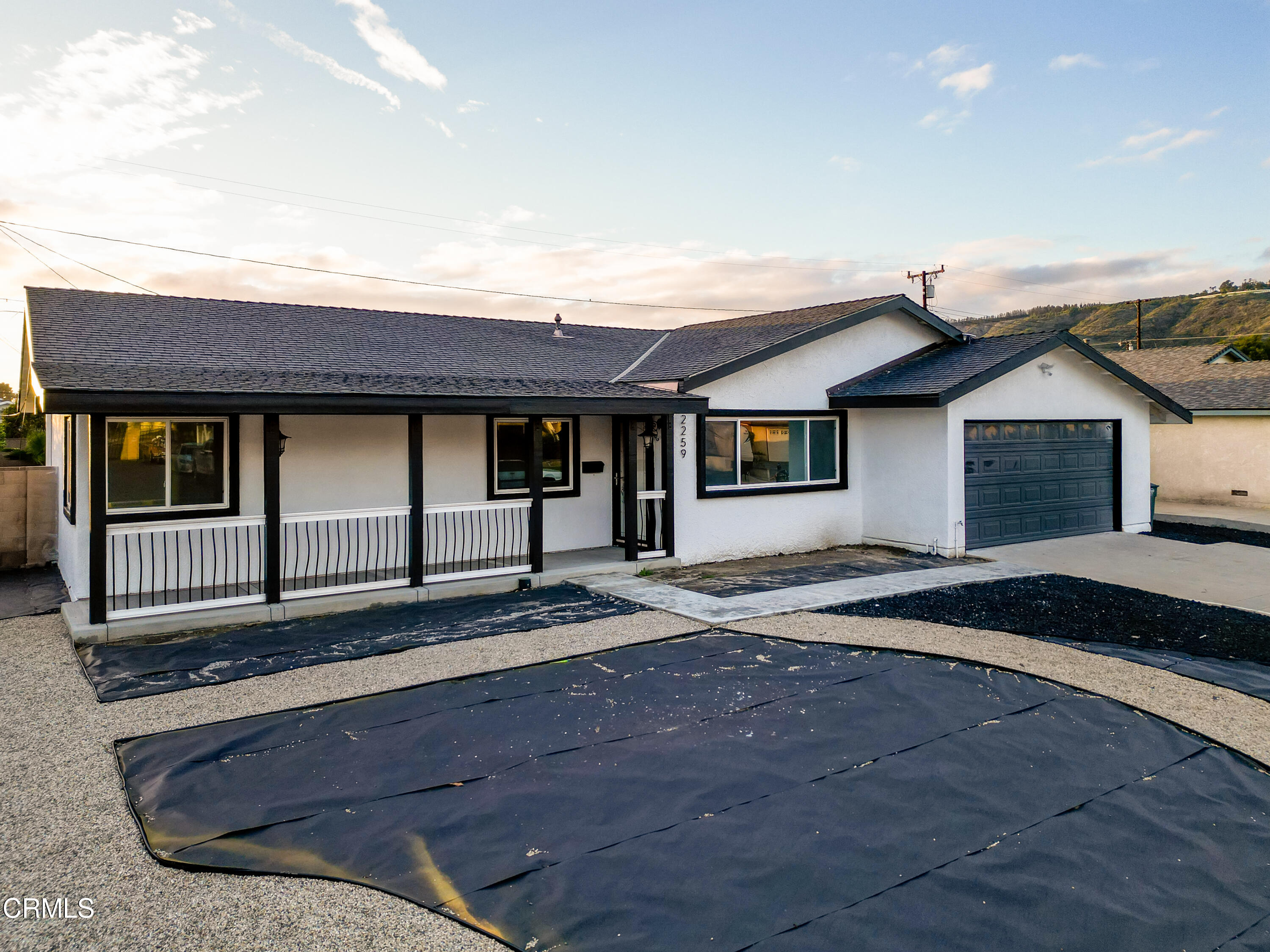 a front view of a house with yard