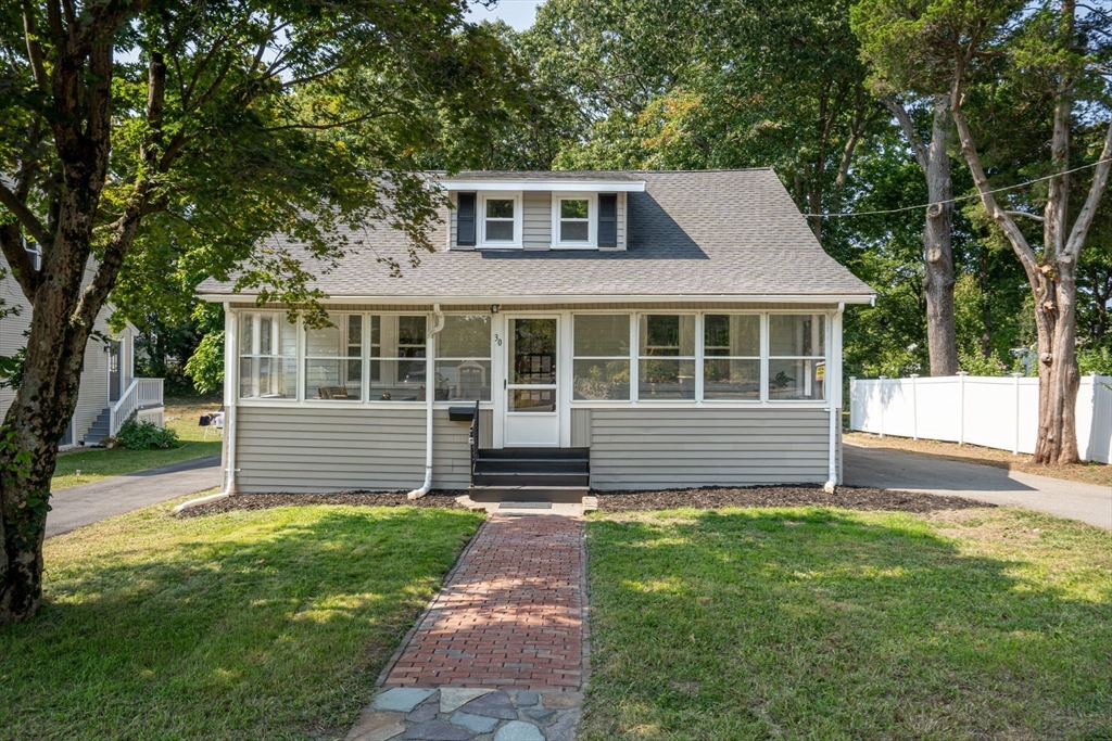 a front view of a house with a yard