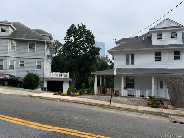 View of front of home featuring covered porch