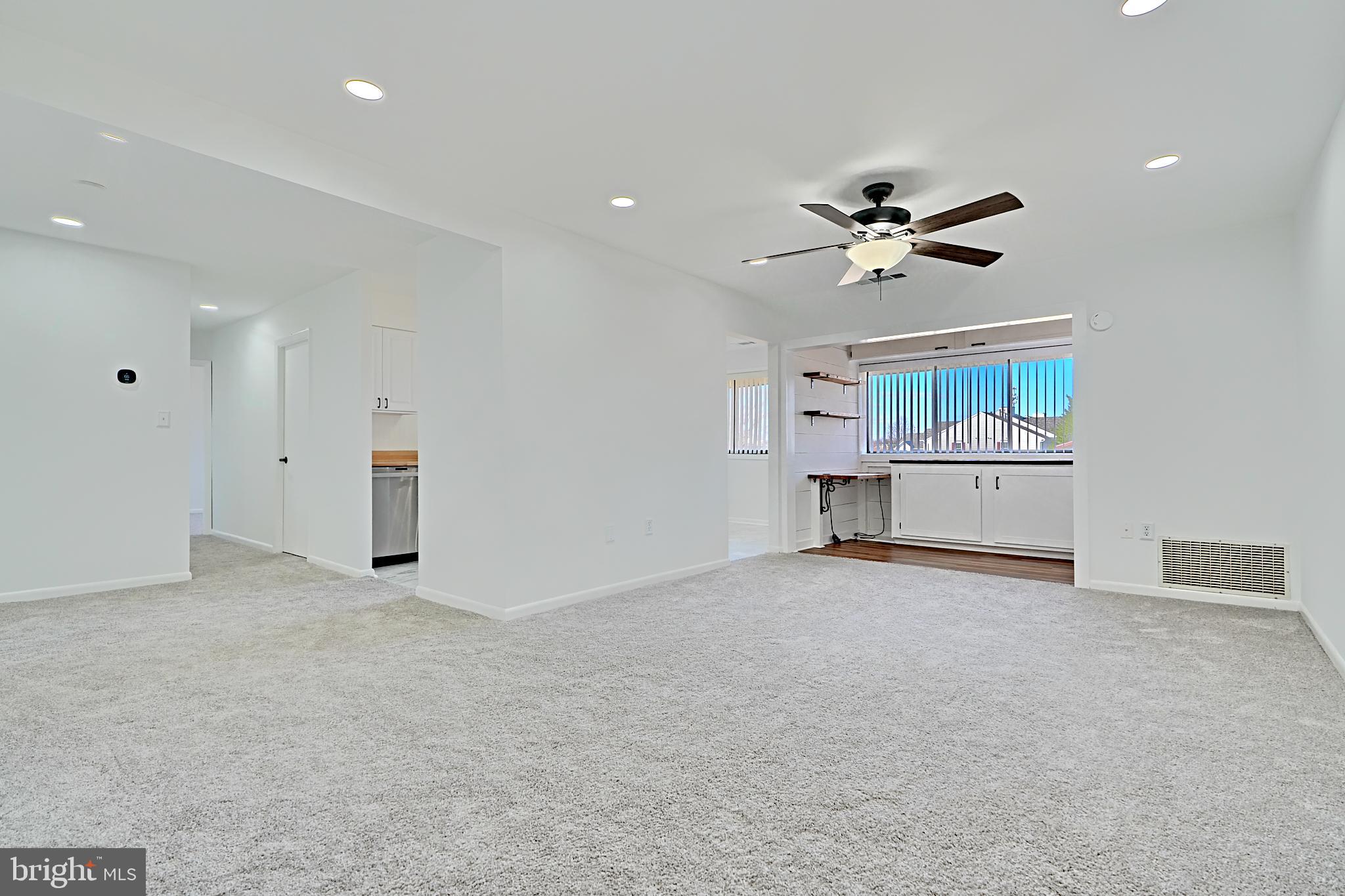 a view of a livingroom with a ceiling fan