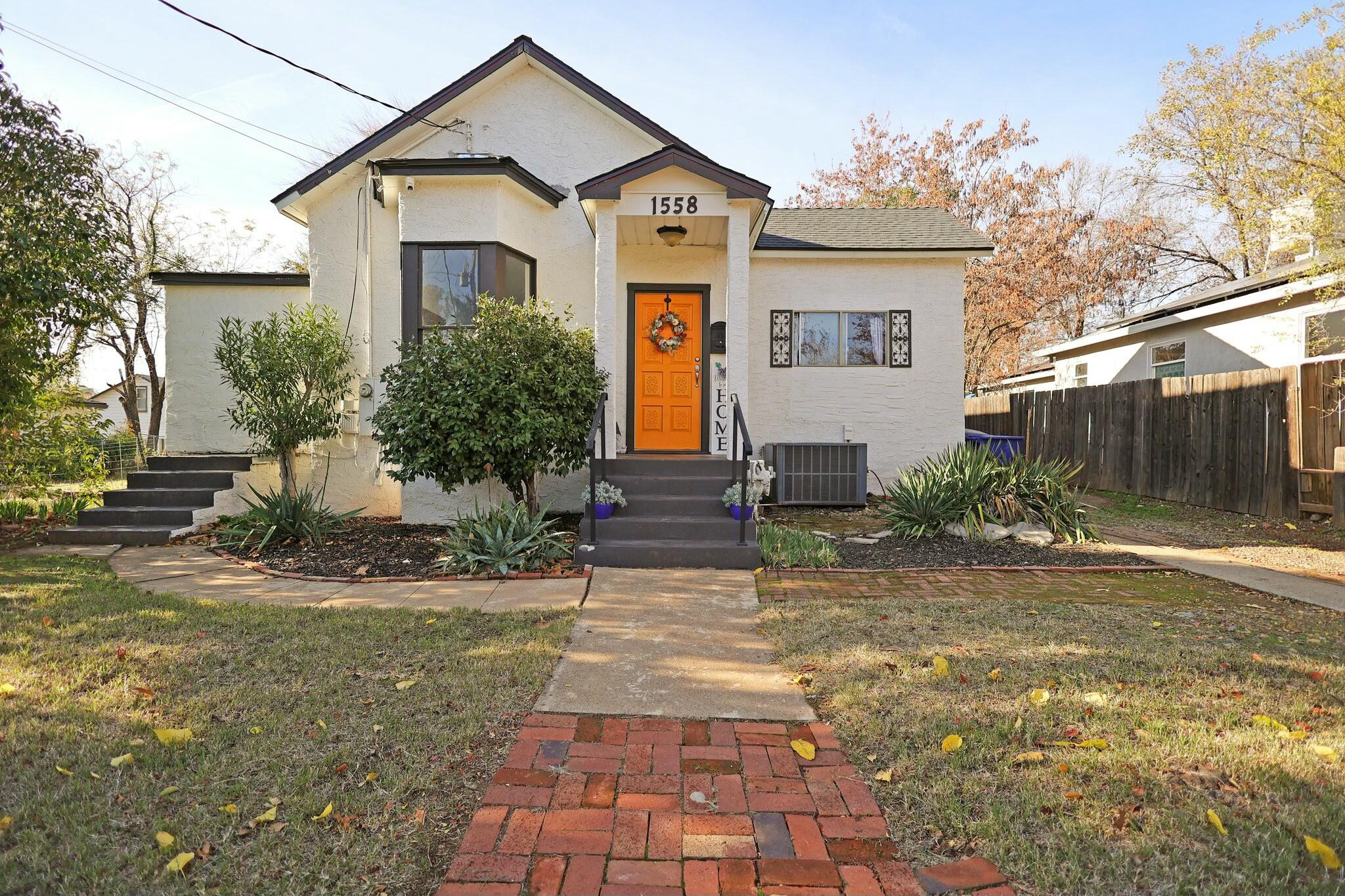 a front view of a house with garden