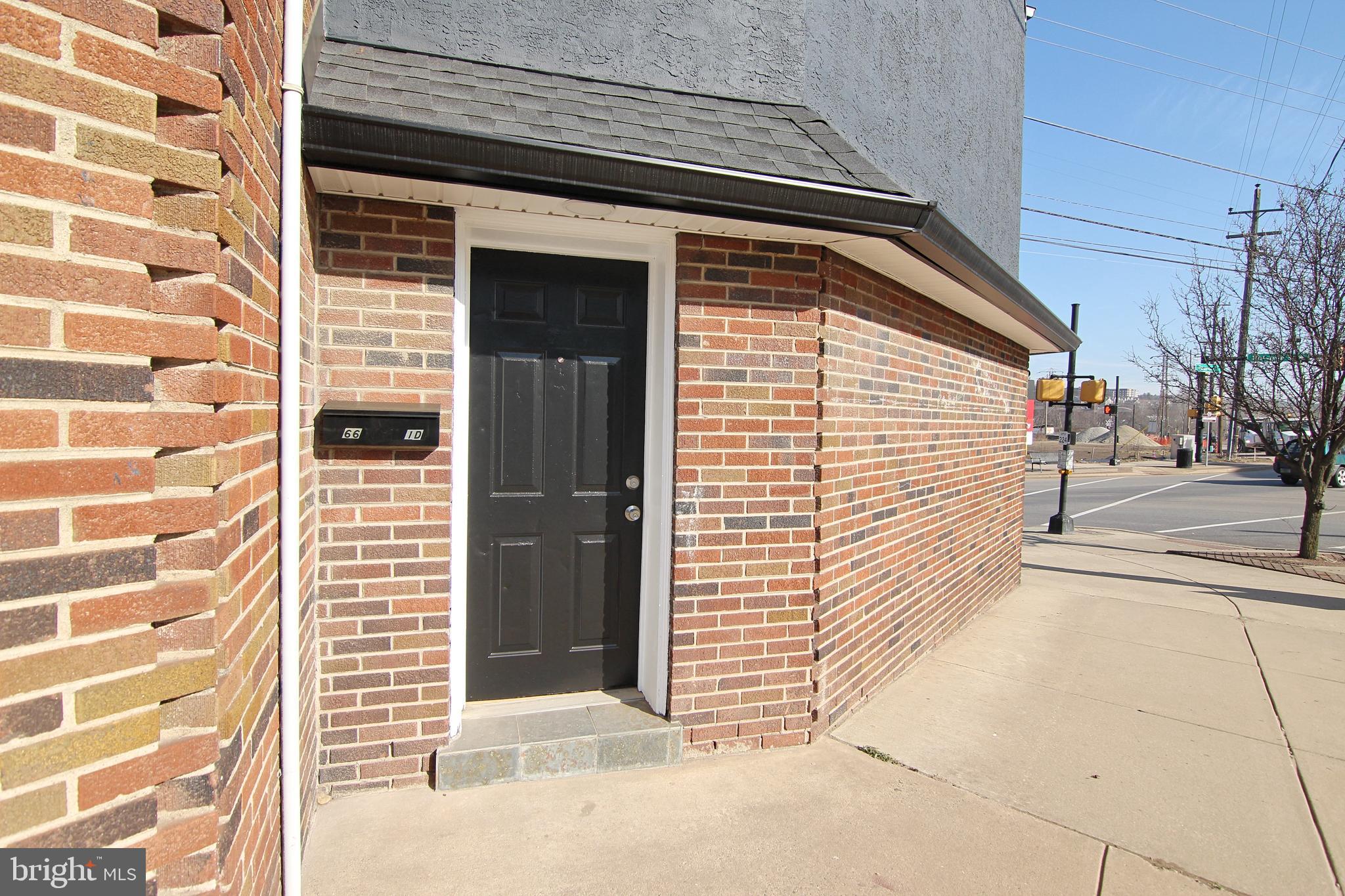 a view of a door with a door and wooden floor