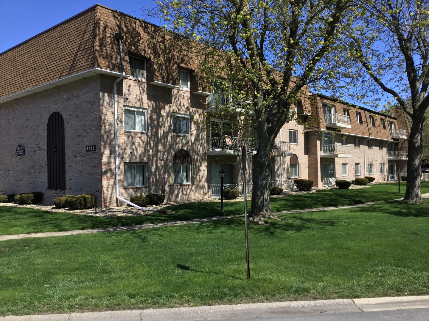 a front view of a building with garden