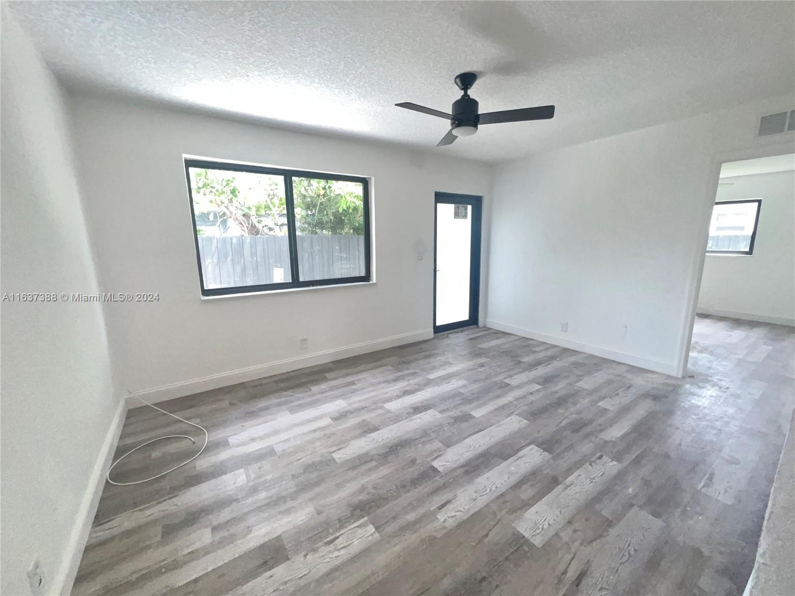 a view of an empty room with a window