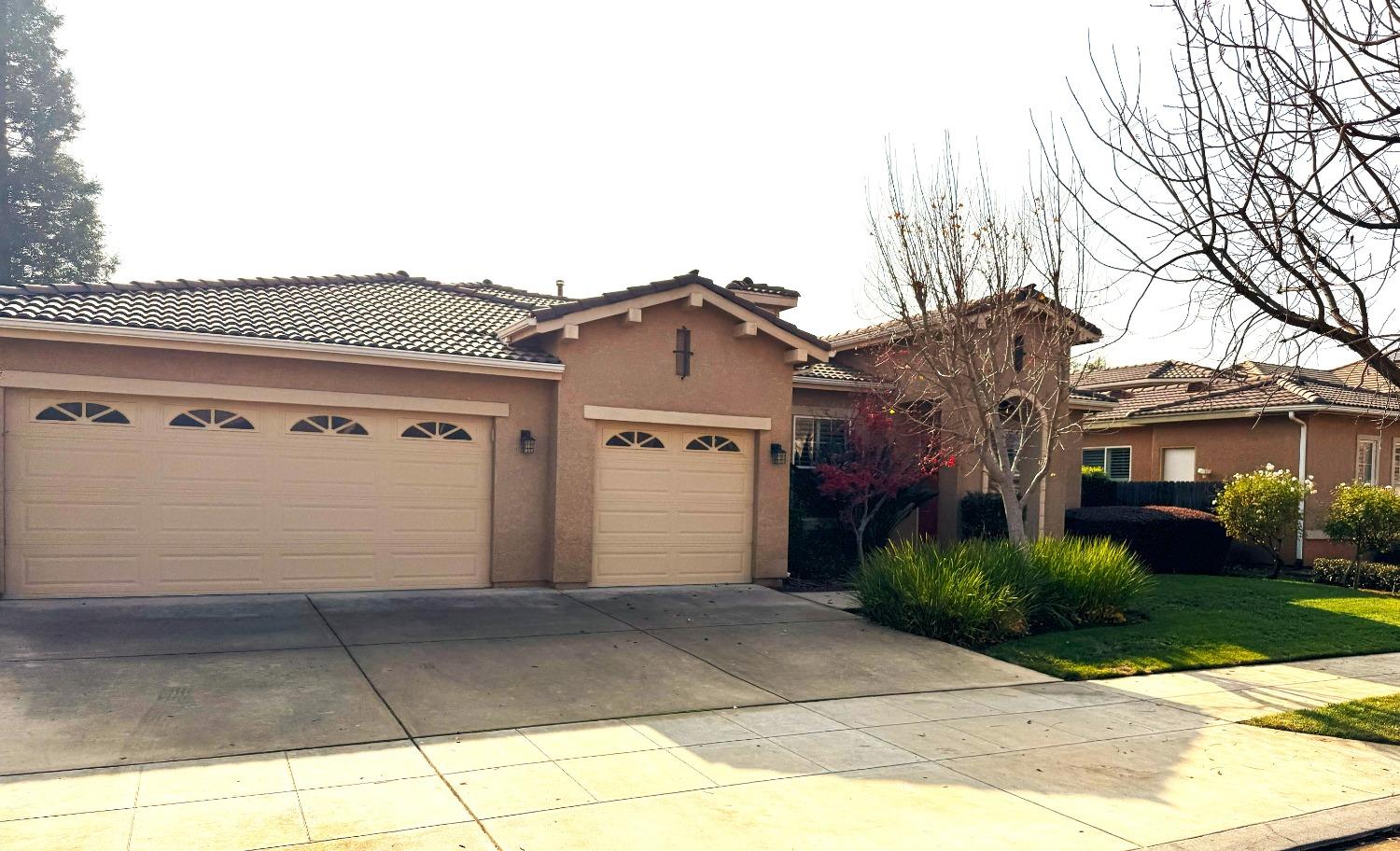 a front view of a house with a garage