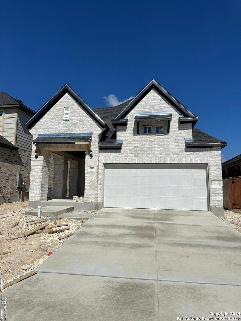 a front view of a house with yard