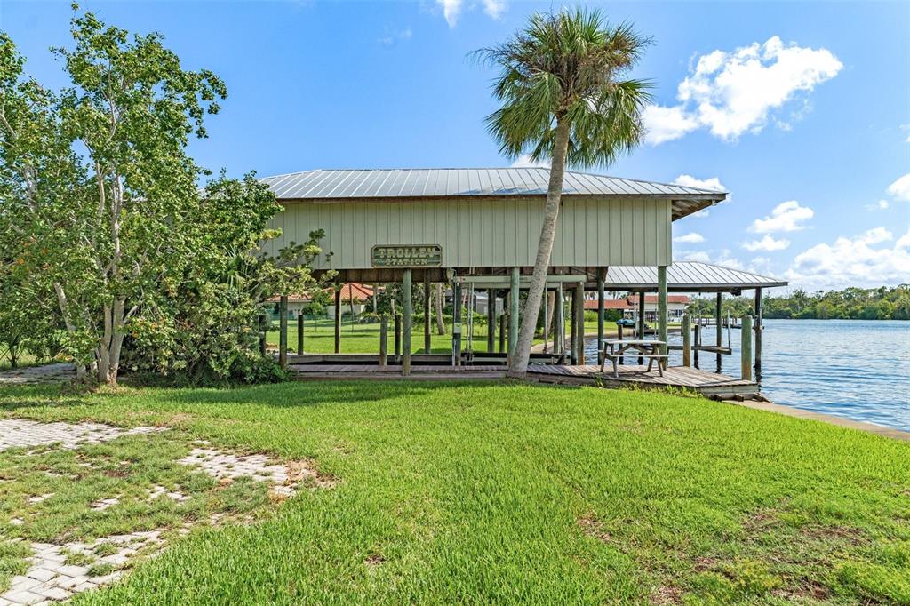 a view of a house with a yard porch and sitting area