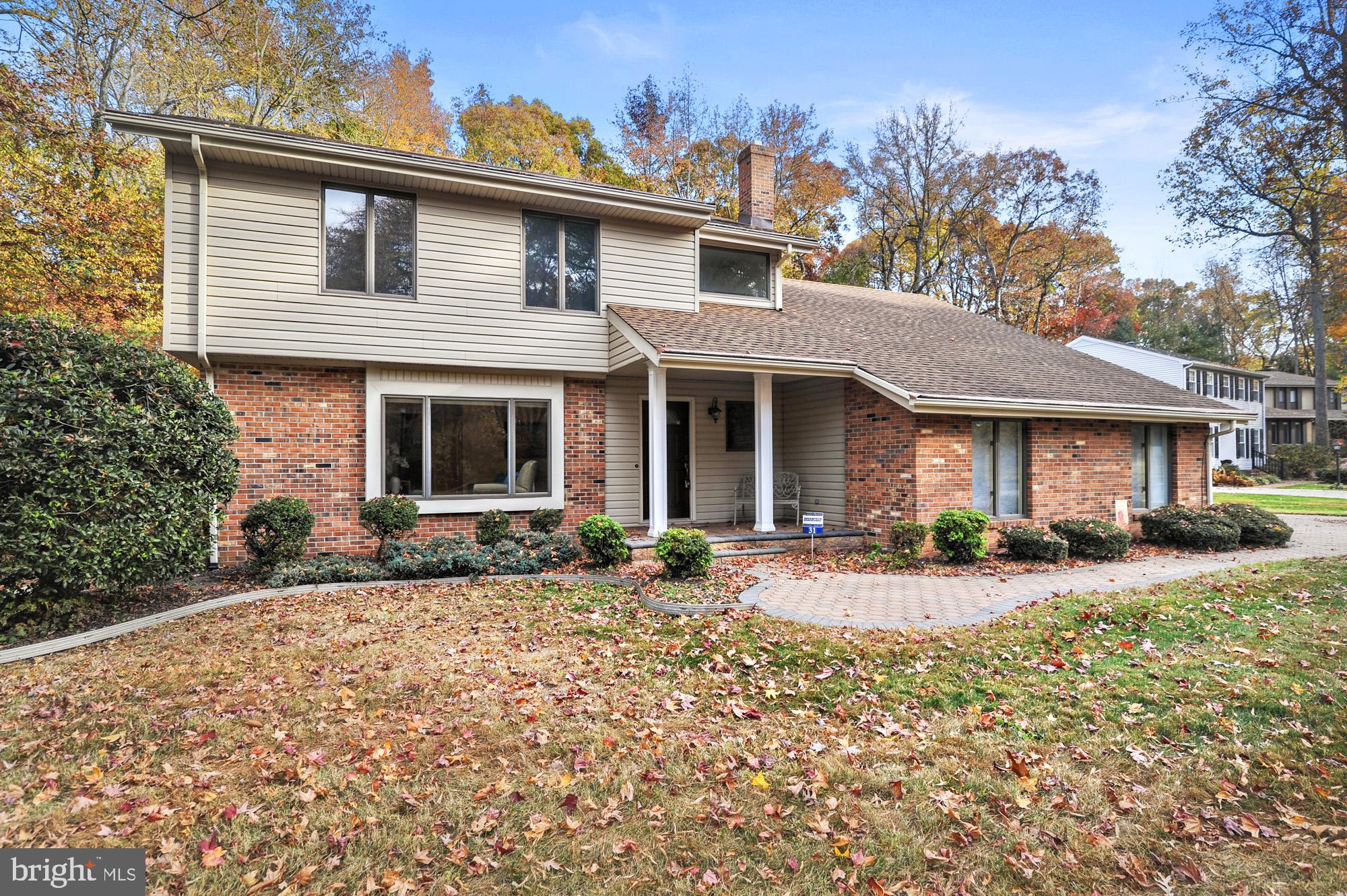 a front view of a house with yard and seating area