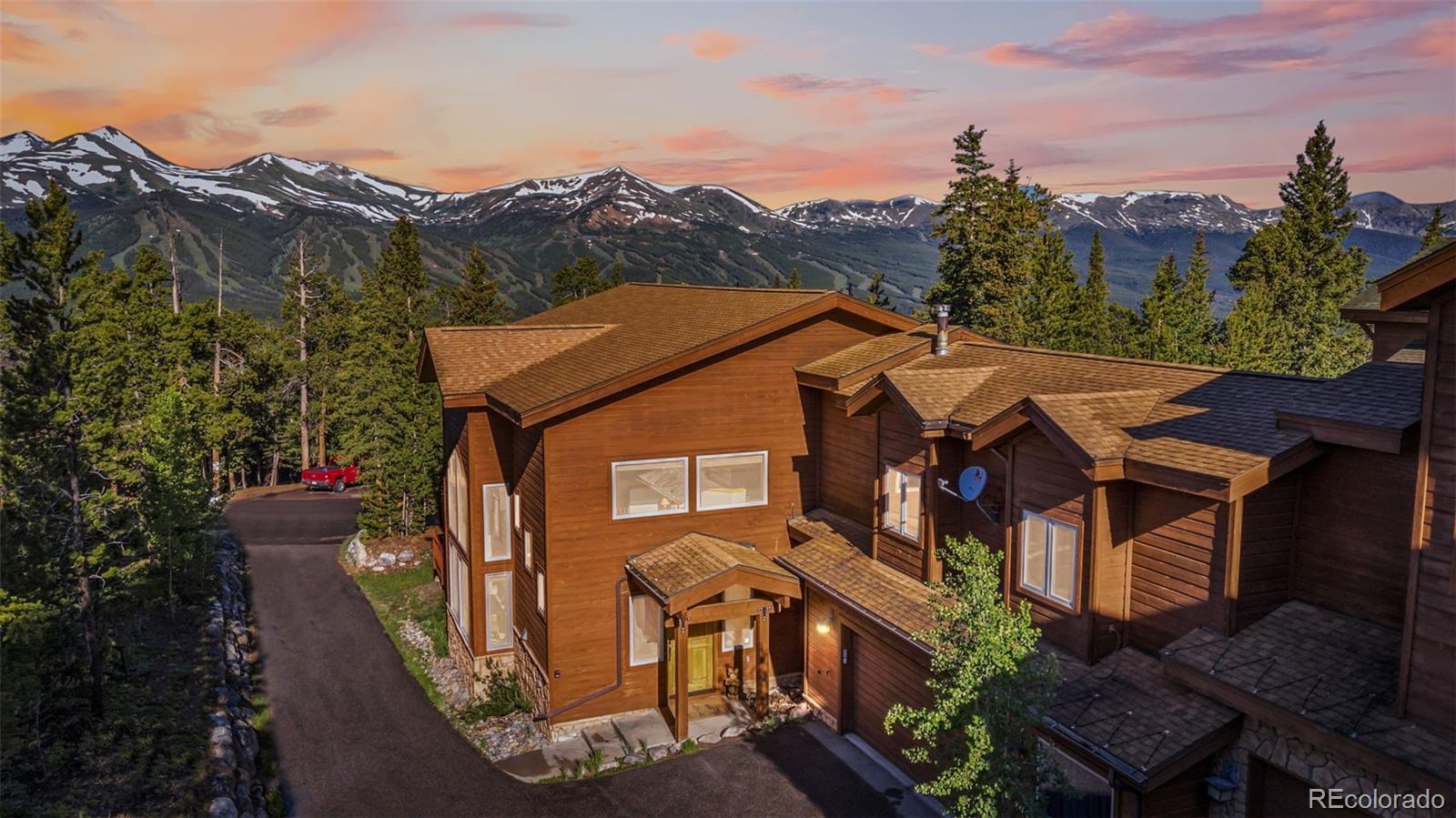 a aerial view of a house with a yard and balcony