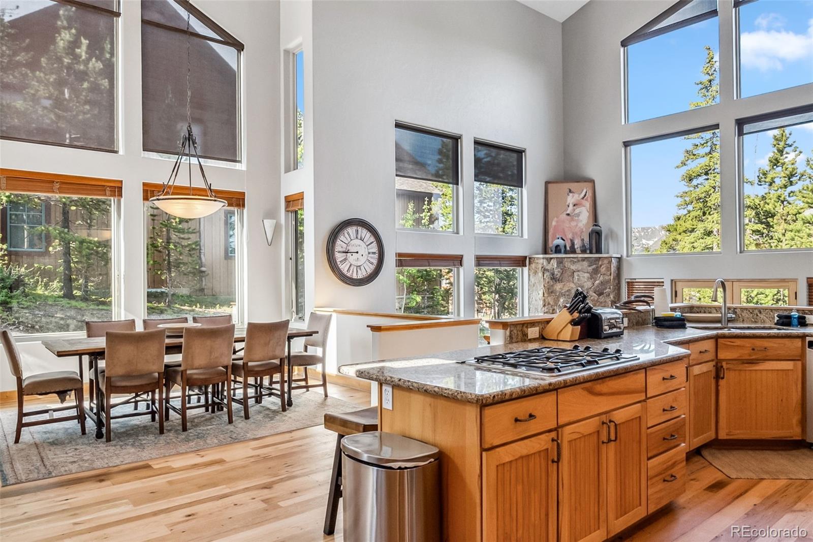 a kitchen with a stove a table and chairs