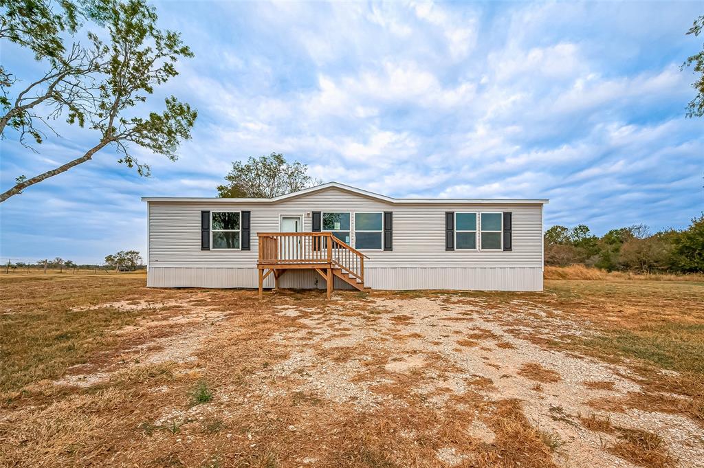 a house with trees in the background