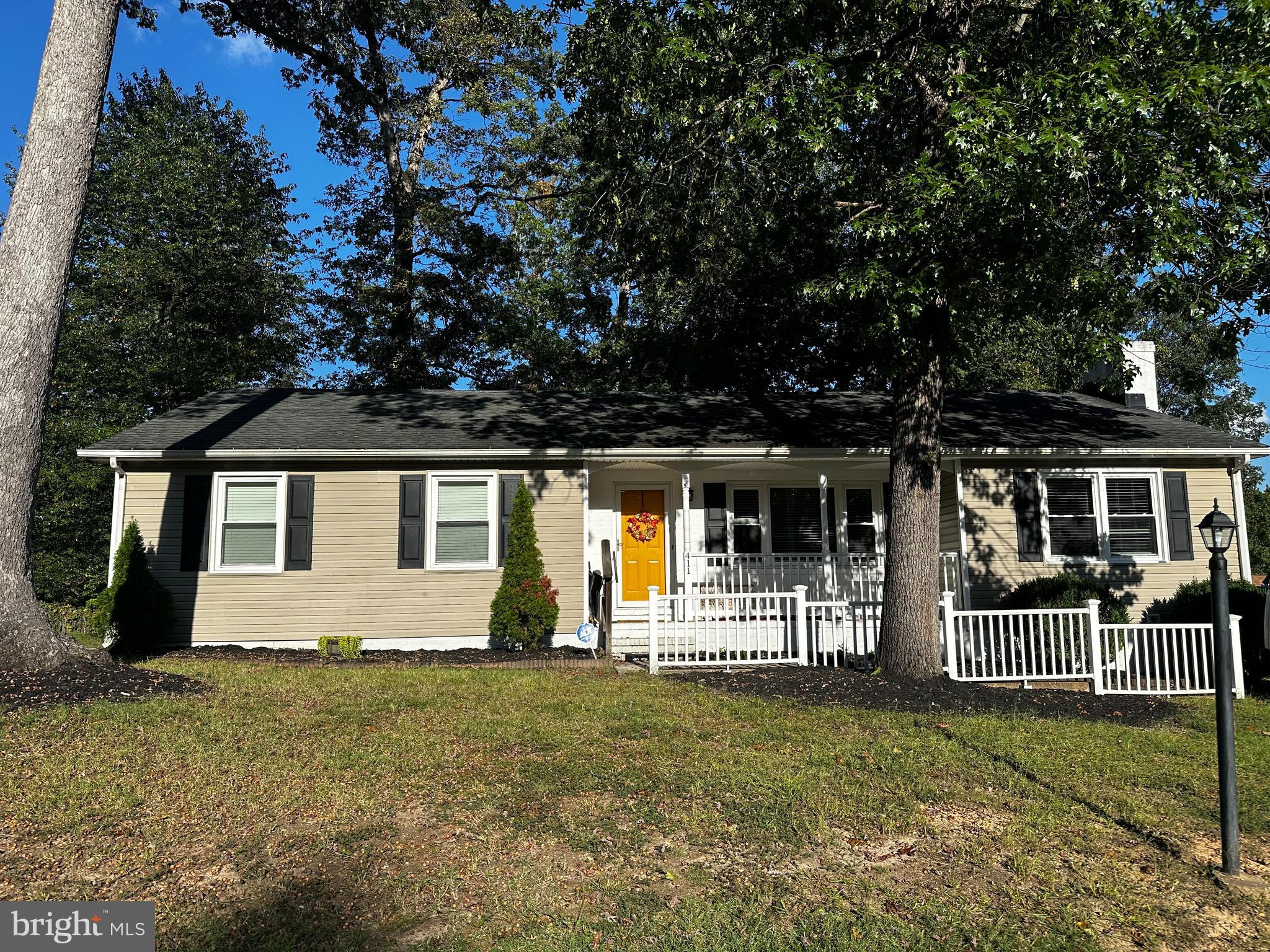 front view of a house with a yard