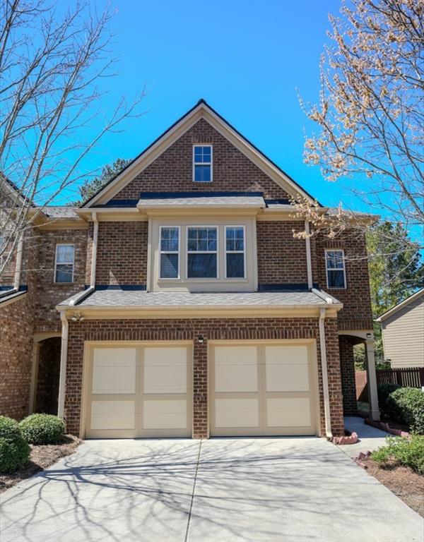 a front view of a house with a garage