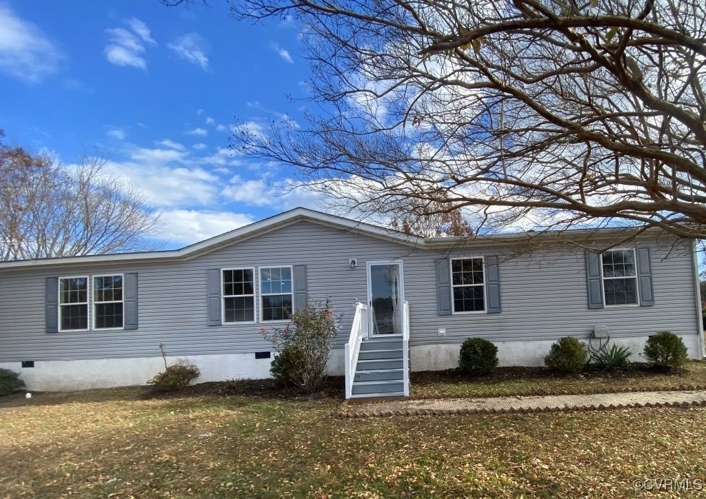 a house that has a tree in front of the house