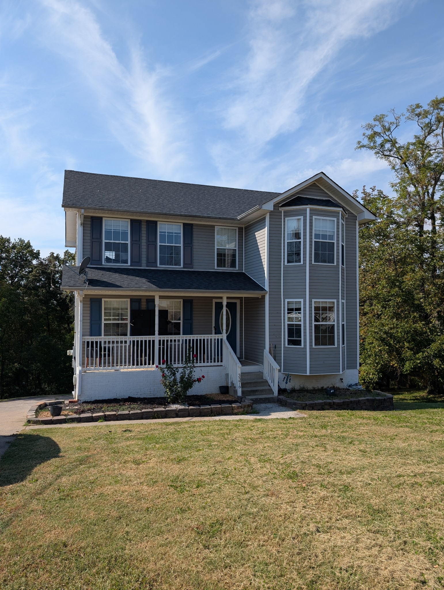 front view of a house with a yard