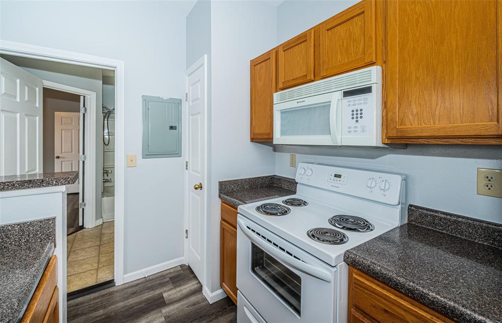 a kitchen with a stove and a microwave