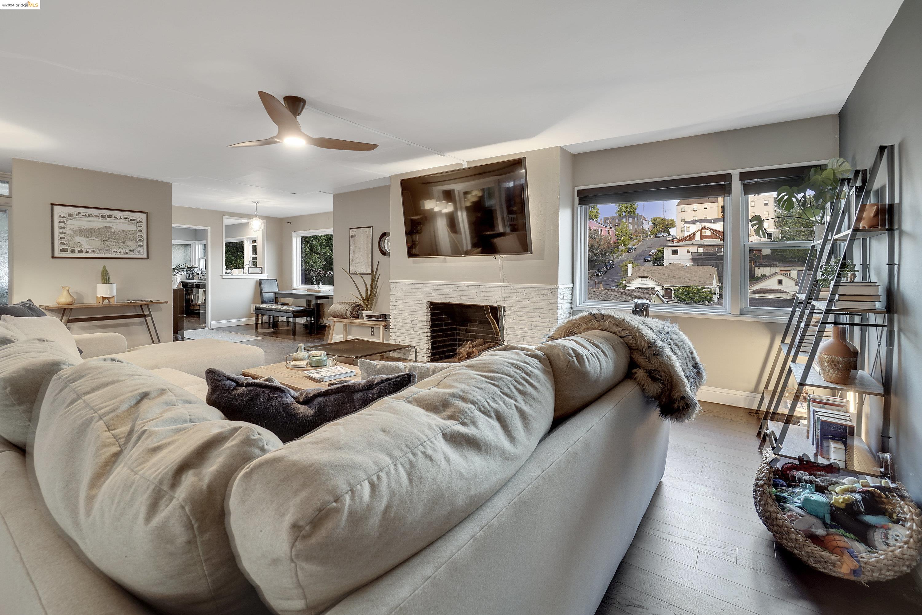 a living room with furniture fireplace and flat screen tv