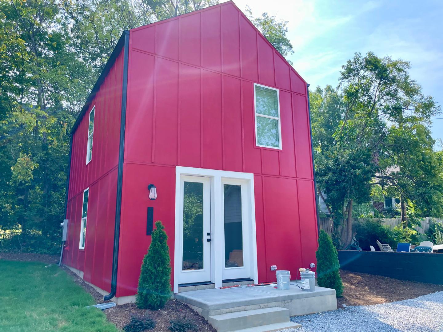 a view of a house with a backyard