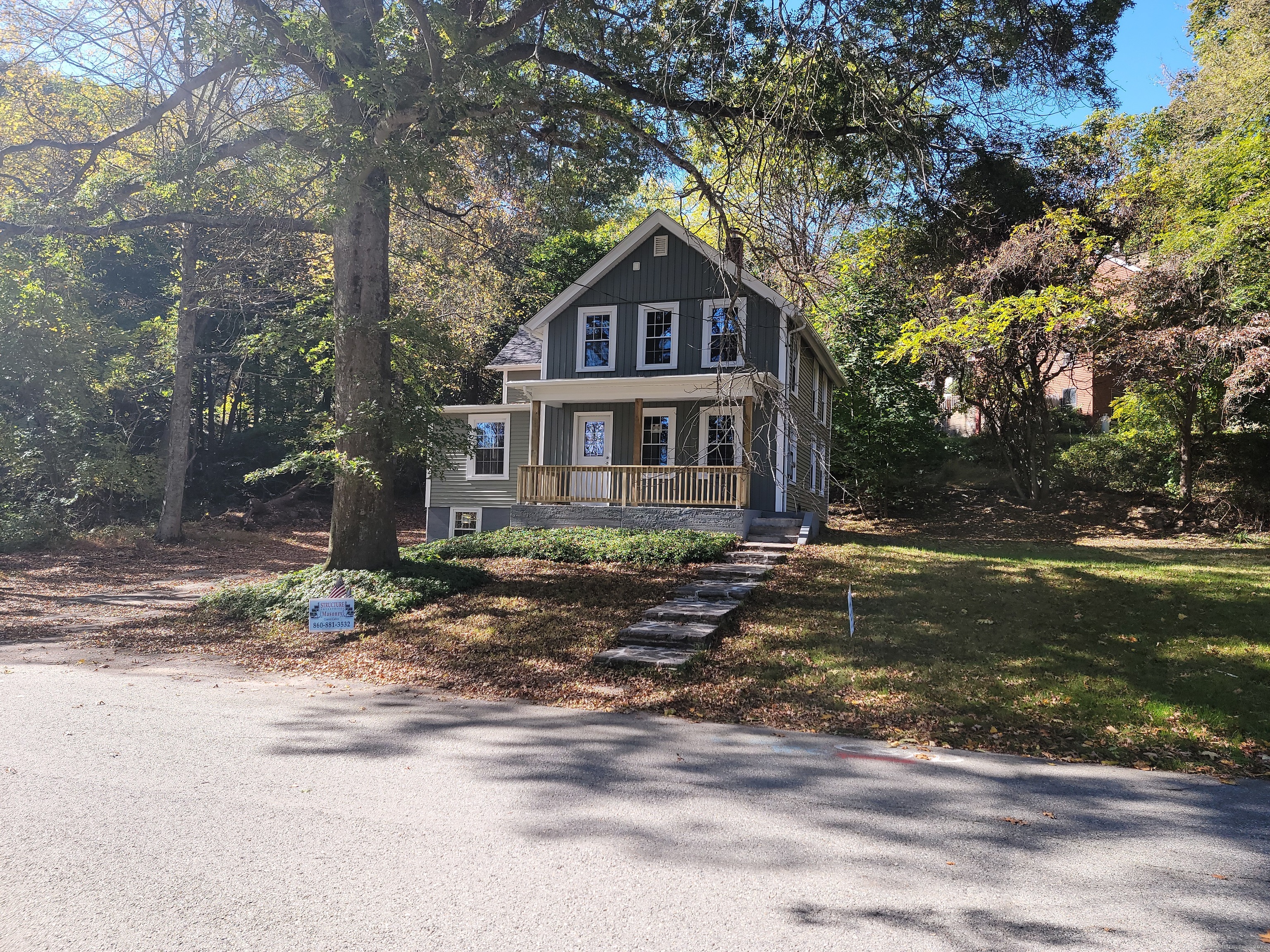 a house with a tree in front of it