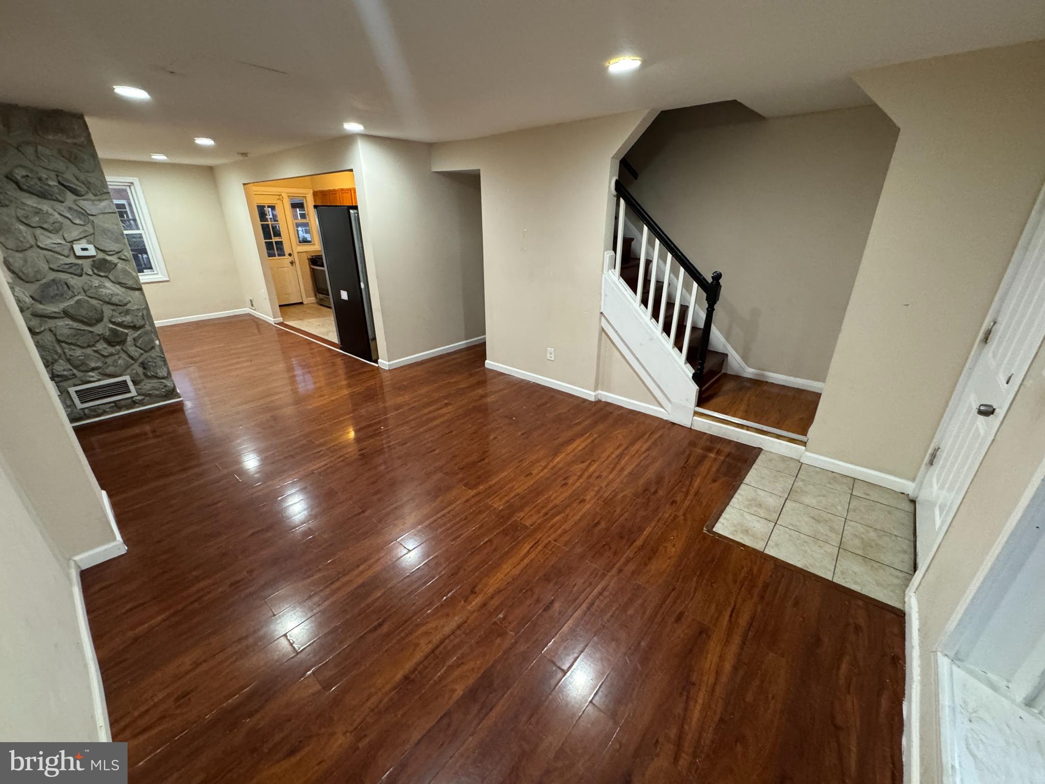 a view of an entryway with wooden floor