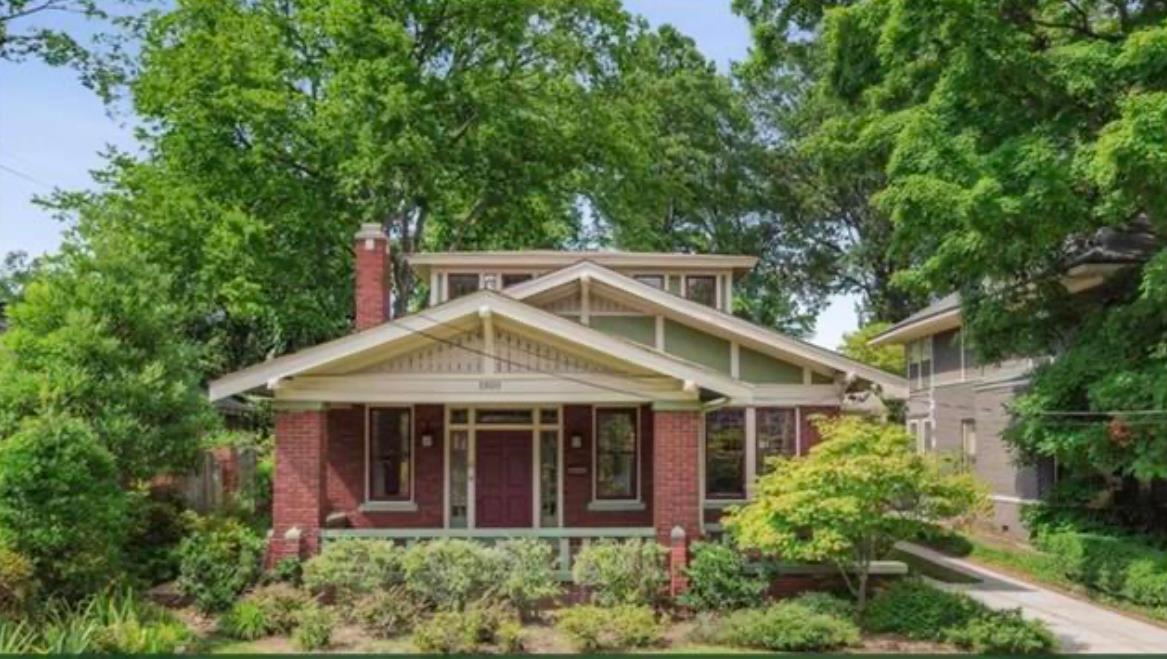 a house with a tree in front of it