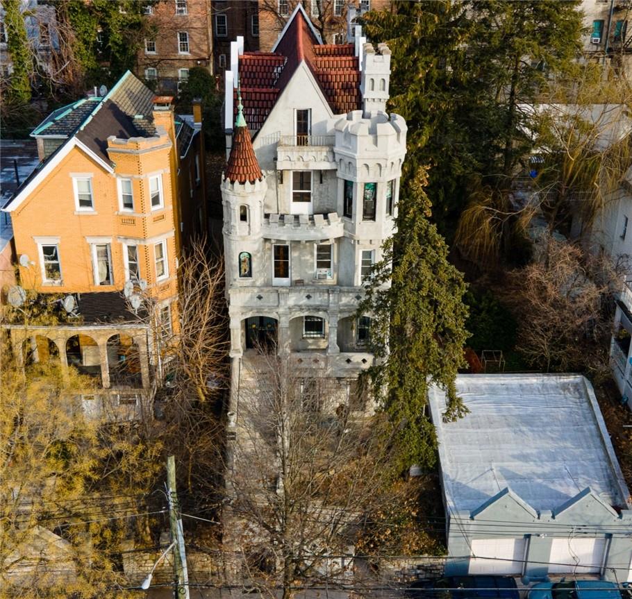 an aerial view of residential houses with outdoor space