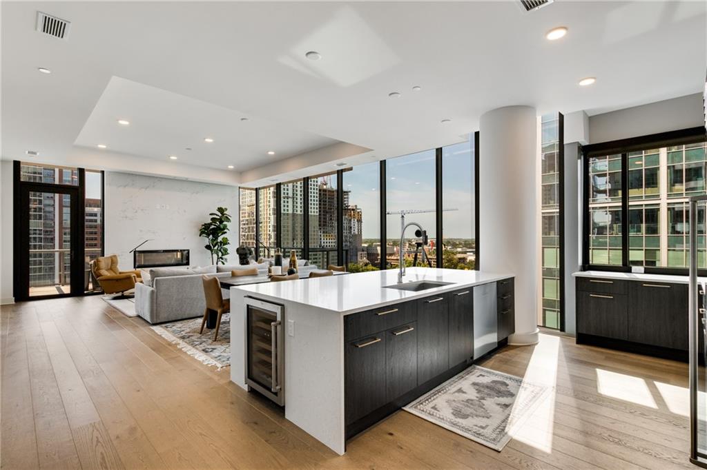 a large kitchen with stainless steel appliances lots of counter top space