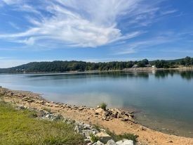 a view of a lake with a city