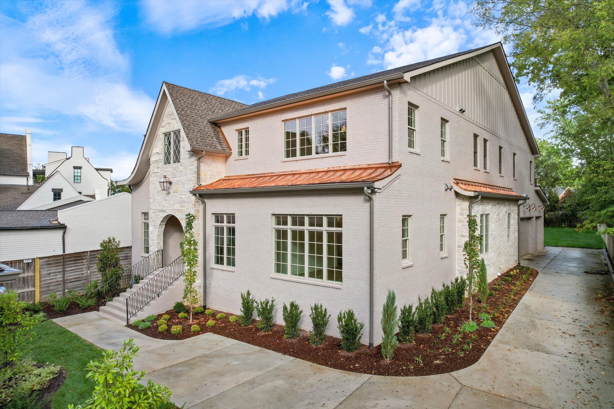 a front view of a house with garden