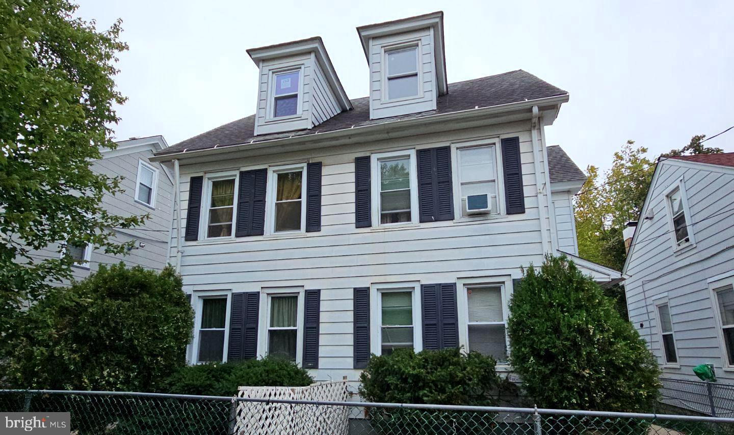 a front view of a house with a porch