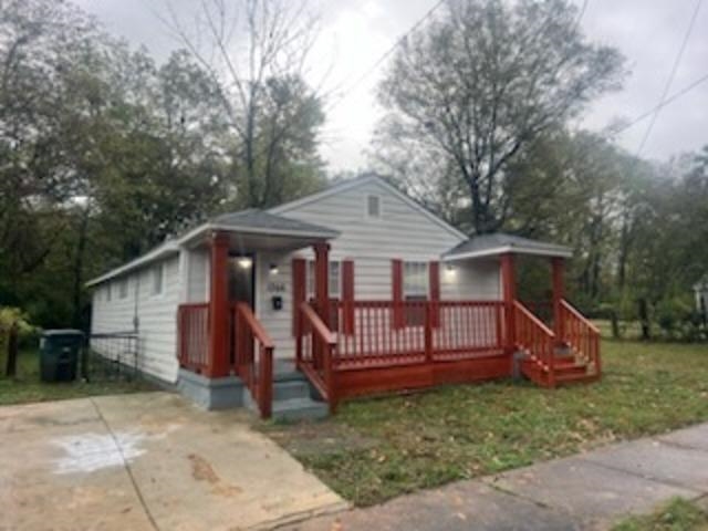 Bungalow-style house with a front yard