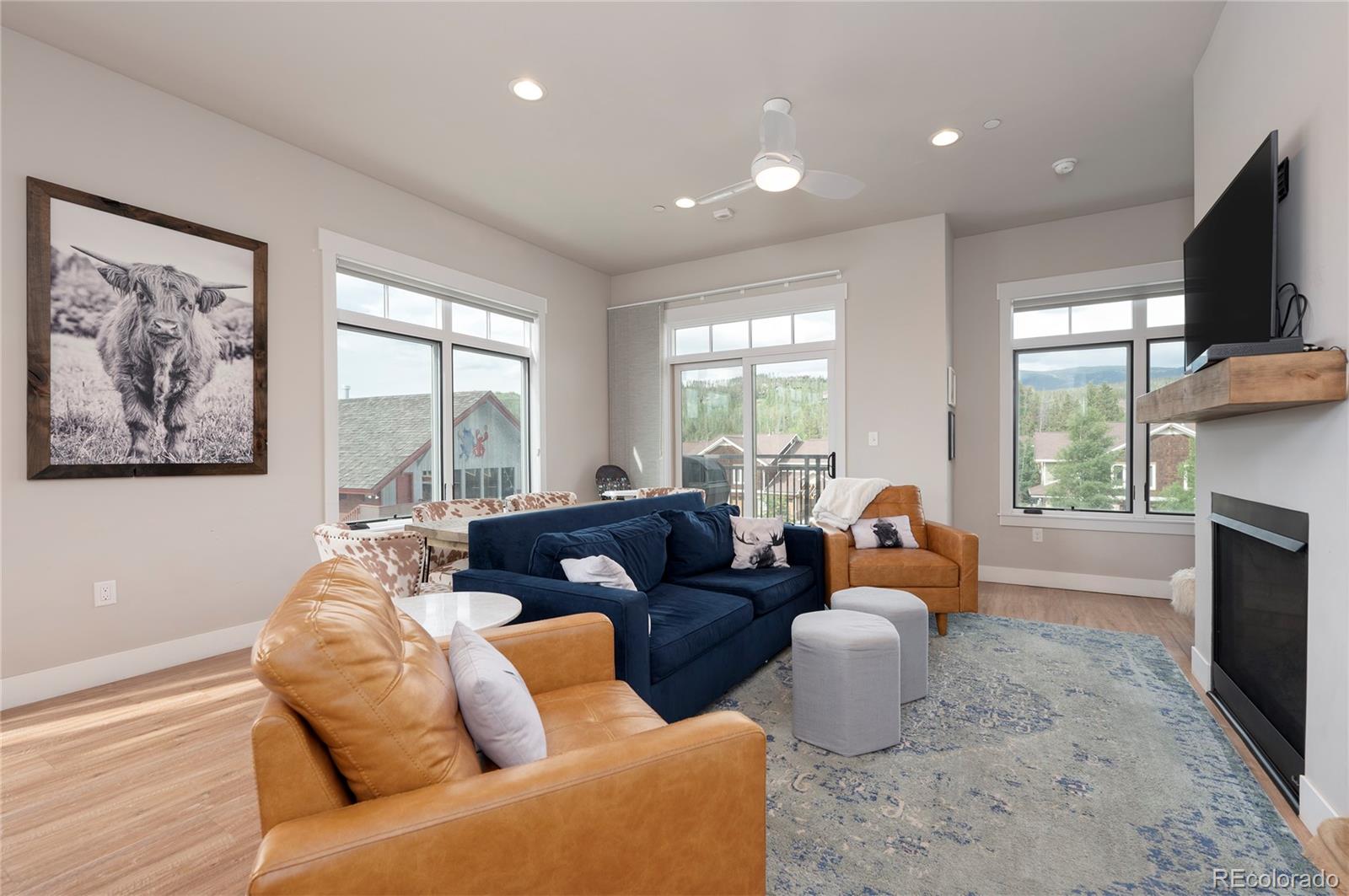 a living room with furniture fireplace and flat screen tv