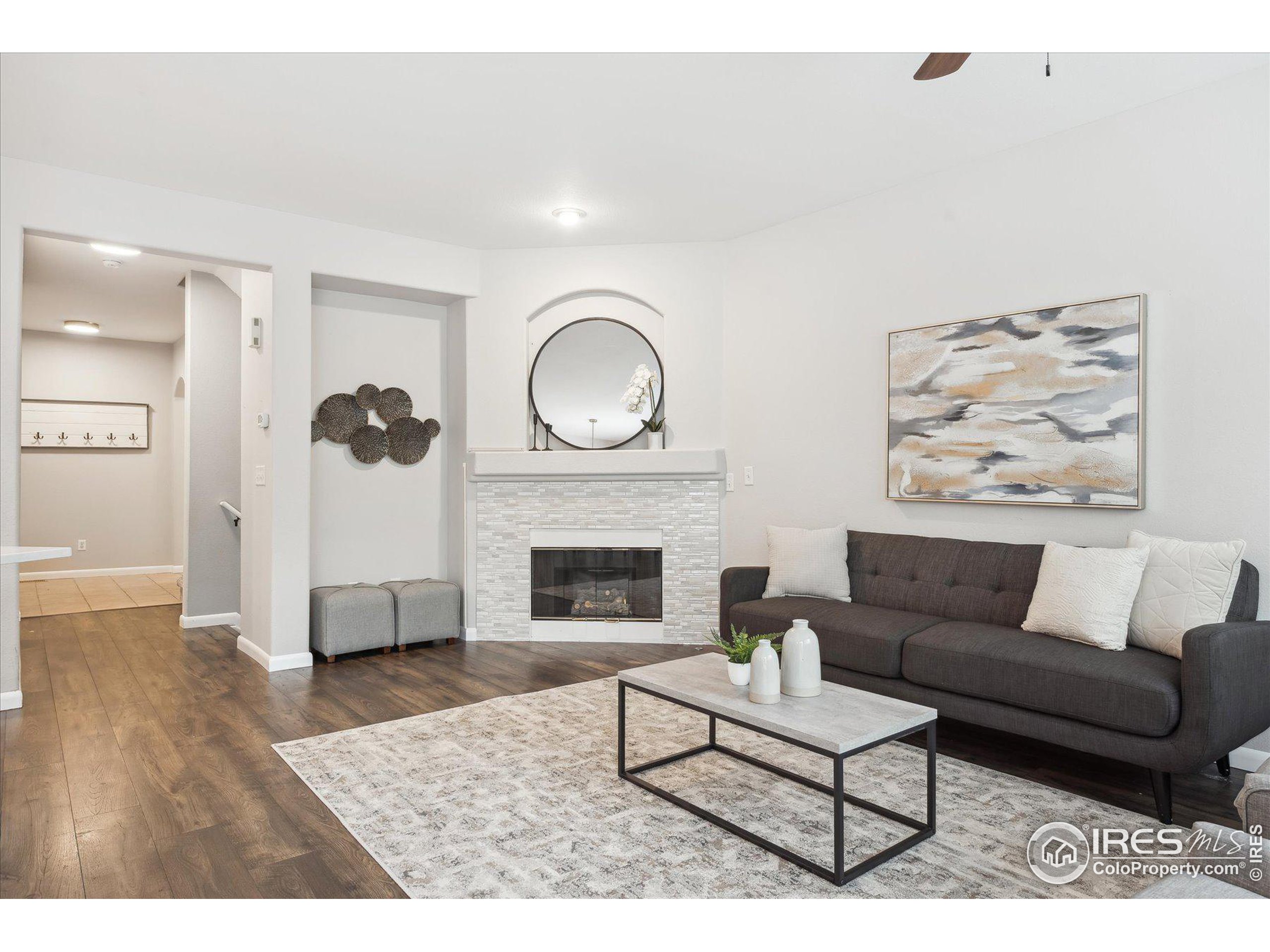 a living room with furniture and a fireplace