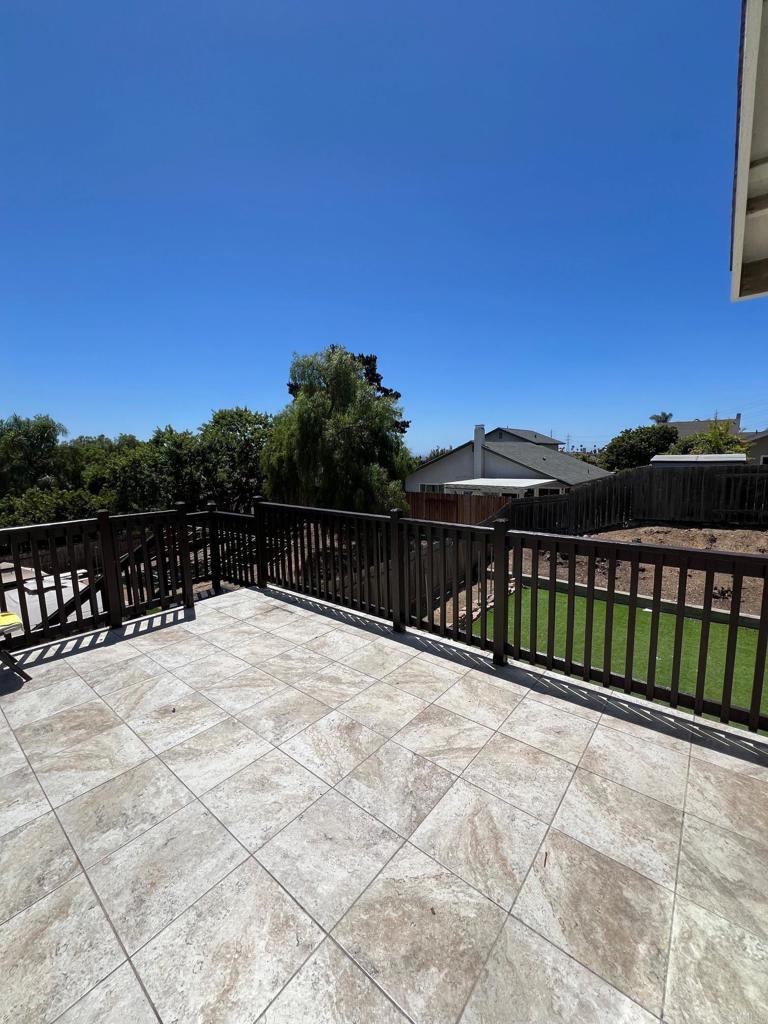 a view of balcony with wooden floor