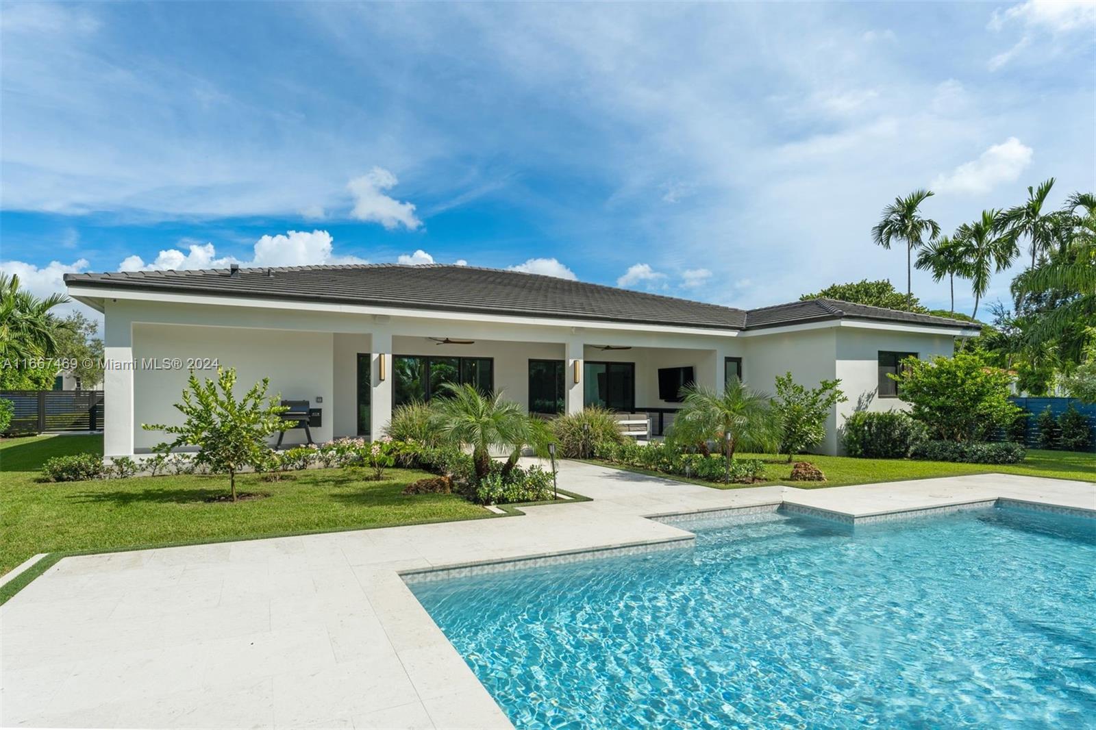 a front view of a house with garden