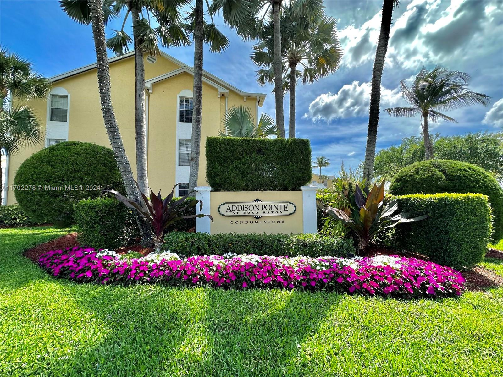 a view of bunch of flowers and trees around