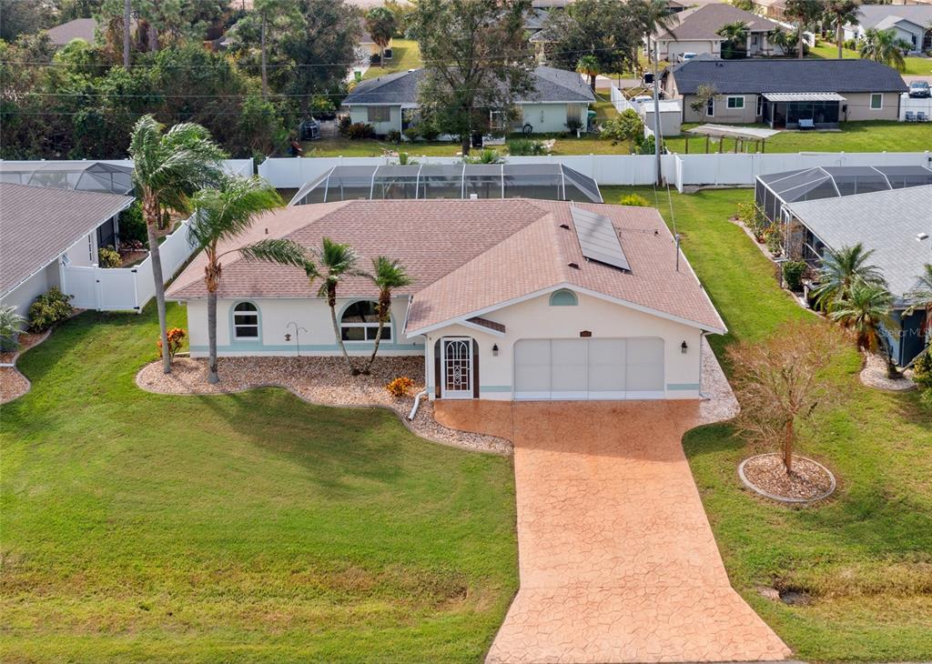 an aerial view of a house with swimming pool