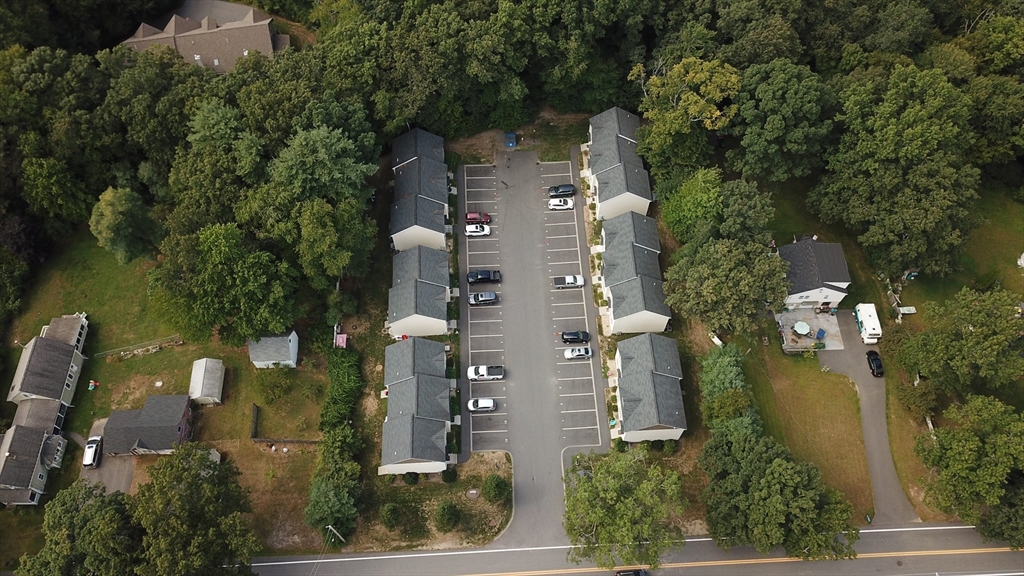 an aerial view of a house with outdoor space and street view