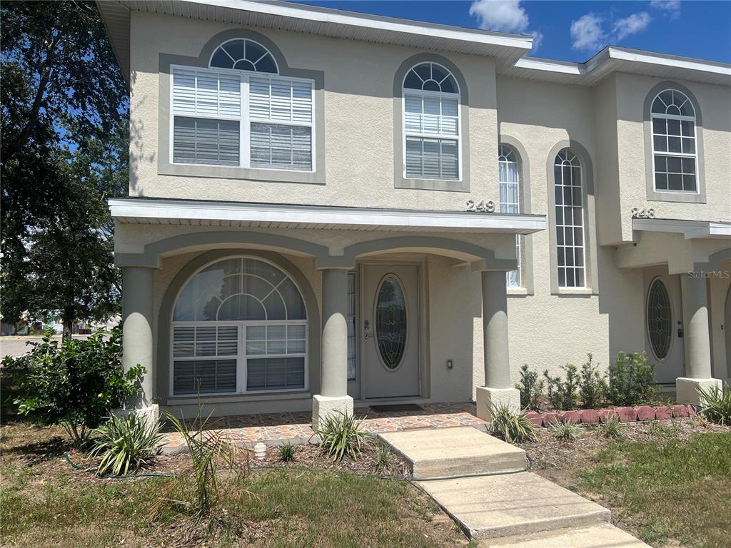 a front view of a house with a yard