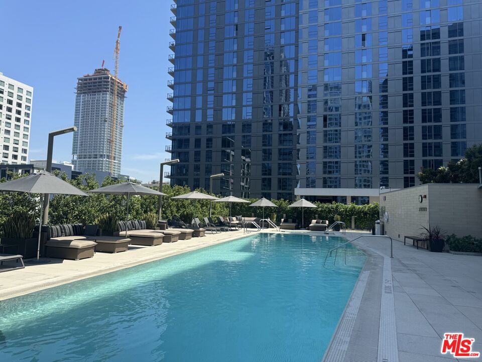 a view of pool with outdoor seating