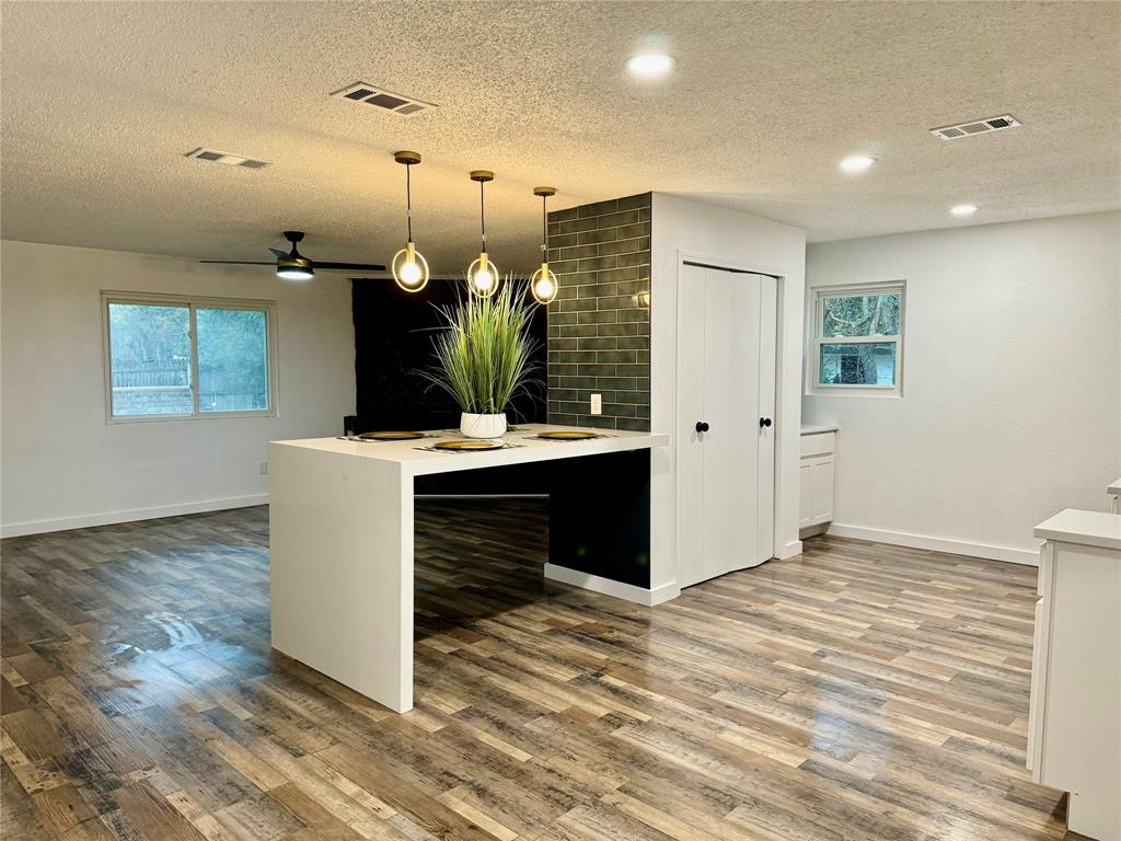 a view of kitchen with cabinets and outdoor space