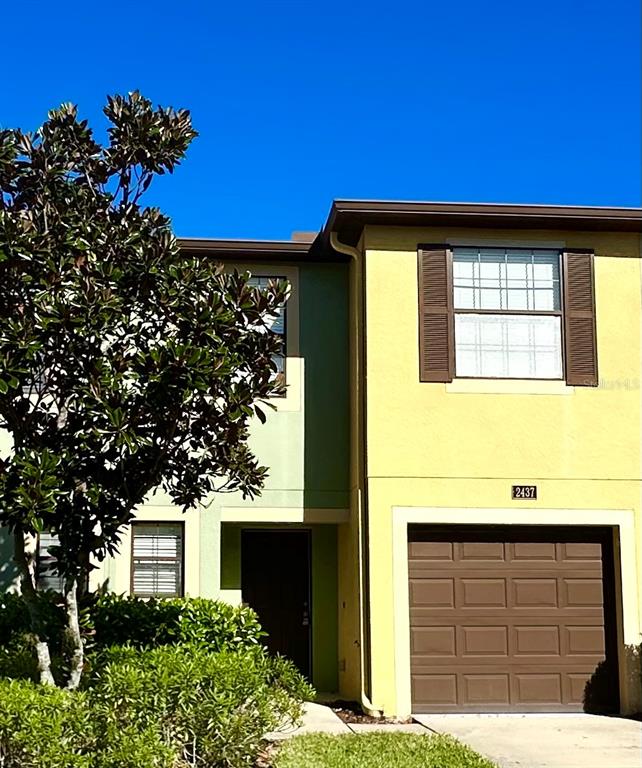 a house with a tree in the background