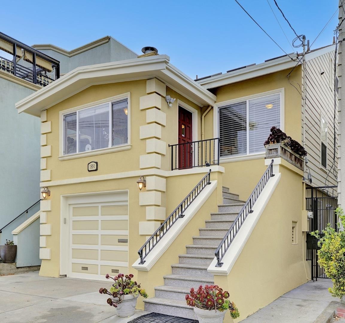 a view of a house with a window and stairs