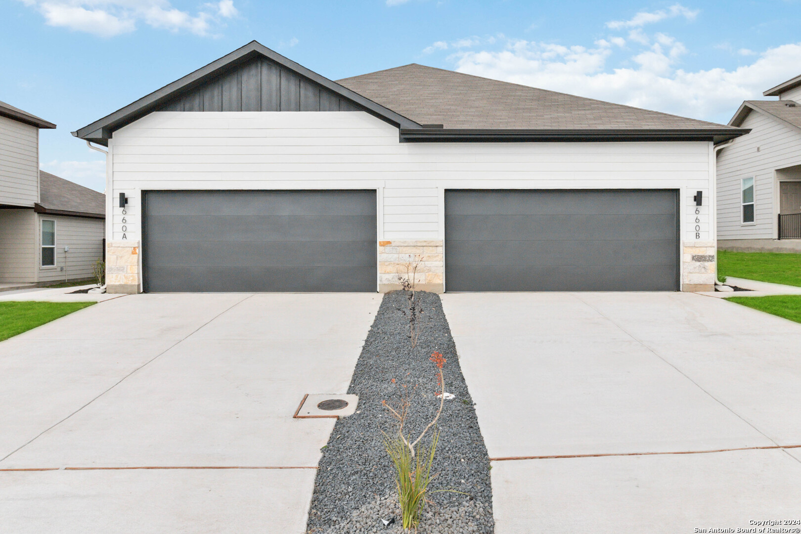 a front view of a house with a garage