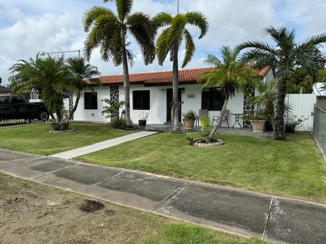 a view of a backyard and a tree