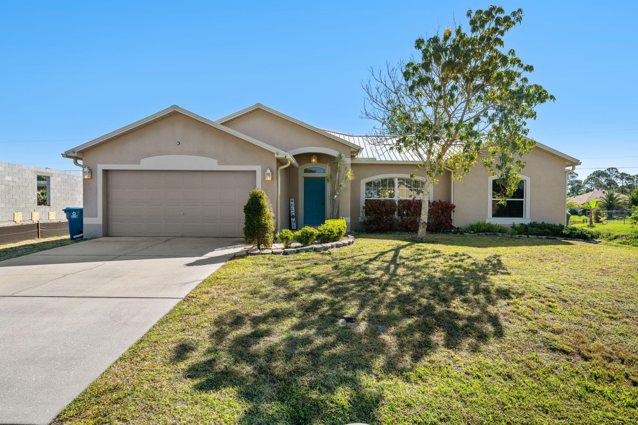 front view of a house with a yard