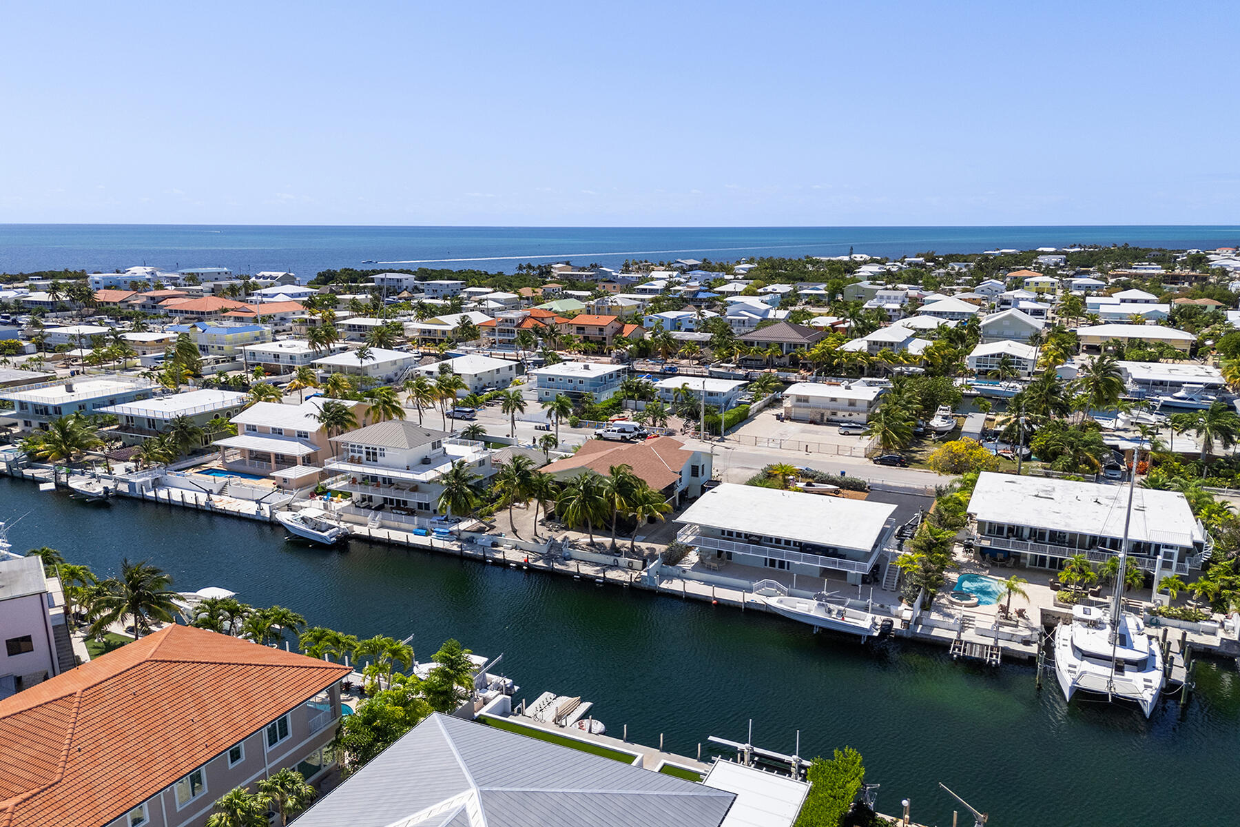 an aerial view of a city with ocean view