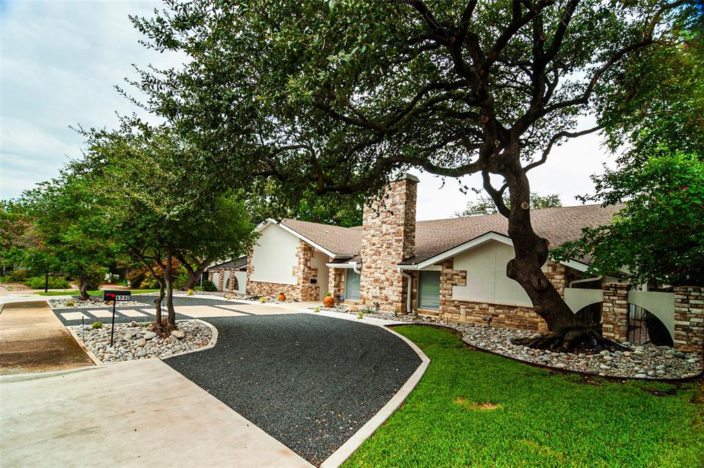 a view of a house with outdoor space and sitting area