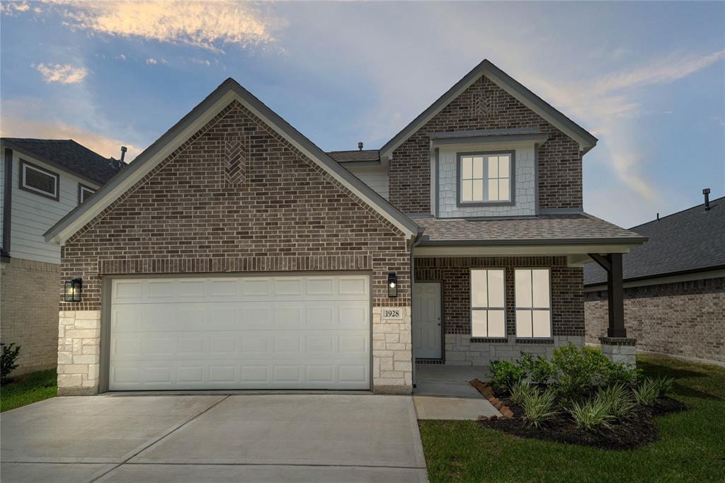 Welcome home to 1928 Scarlet Yaupon Way located in Barton Creek Ranch and zoned to Conroe ISD.