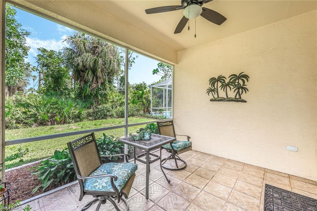 a view of a patio with a table and chairs